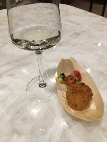 Sip & Sizzle pairing of Two Sisters Sauvignon Blanc and a cod fritter.